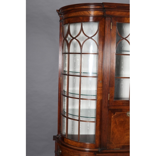 411 - A TITCHMARCH & GOODWIN MAHOGANY DISPLAY CABINET OF 'D' SHAPE having a moulded cornice above two trac... 