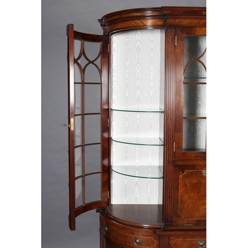 411 - A TITCHMARCH & GOODWIN MAHOGANY DISPLAY CABINET OF 'D' SHAPE having a moulded cornice above two trac... 