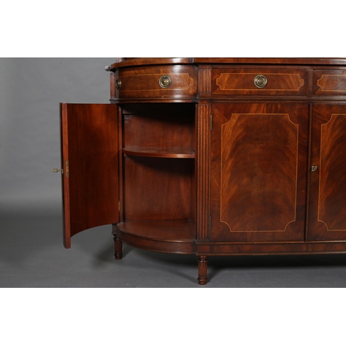 411 - A TITCHMARCH & GOODWIN MAHOGANY DISPLAY CABINET OF 'D' SHAPE having a moulded cornice above two trac... 