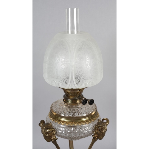 28 - AN EARLY 20TH CENTURY ORMOLU MOUNTED OIL LAMP having a Messenger Patent Duplex burner, the cut glass... 