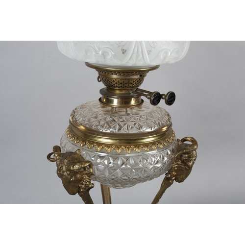 28 - AN EARLY 20TH CENTURY ORMOLU MOUNTED OIL LAMP having a Messenger Patent Duplex burner, the cut glass... 