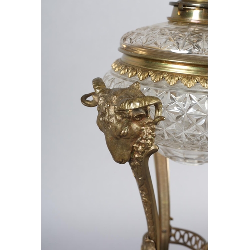 28 - AN EARLY 20TH CENTURY ORMOLU MOUNTED OIL LAMP having a Messenger Patent Duplex burner, the cut glass... 