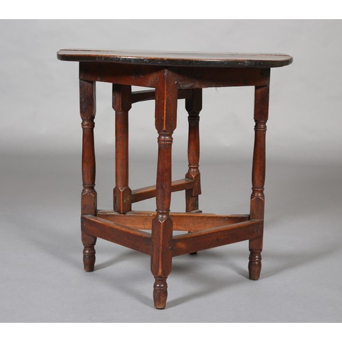 427 - A SMALL 18TH CENTURY OAK GATELEG TABLE, circular with single drop leaf, an turned and square framing... 