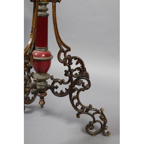 384 - A LATE 19TH CENTURY CAST GILT METAL AND MAROON POTTERY STANDARD LAMP with circular tier and telescop... 