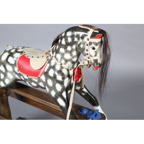 42 - A MID/LATE 20TH CENTURY ROCKING HORSE IN THE STYLE OF COLLINSON having black and white dappled body ... 