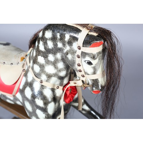 42 - A MID/LATE 20TH CENTURY ROCKING HORSE IN THE STYLE OF COLLINSON having black and white dappled body ... 