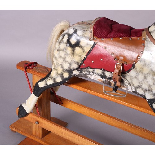 43 - A MID 20th CENTURY ROCKING HORSE IN THE STYLE OF COLLINSON having black and white dappled body with ... 