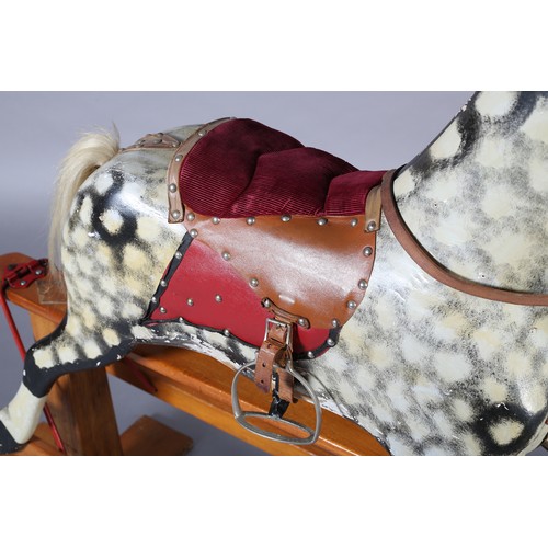 43 - A MID 20th CENTURY ROCKING HORSE IN THE STYLE OF COLLINSON having black and white dappled body with ... 