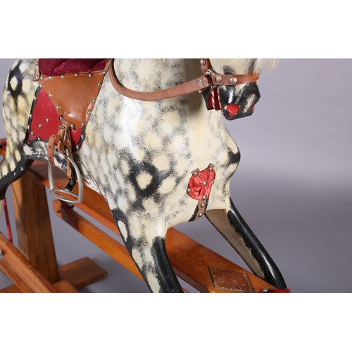 43 - A MID 20th CENTURY ROCKING HORSE IN THE STYLE OF COLLINSON having black and white dappled body with ... 