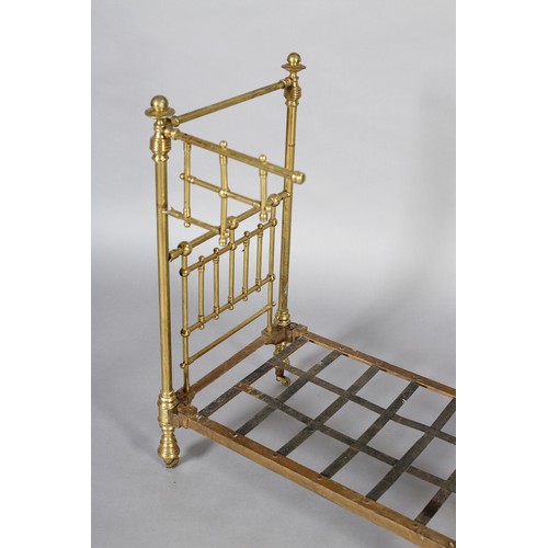 34 - A VICTORIAN DOLL'S BRASS AND IRON HALF-TESTER BED with wide brass knob finials (at fault), 73cm high... 