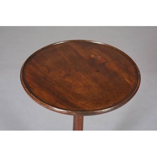 394 - A GEORGE III MAHOGANY TRIPOD TABLE having a circular dished top on a slender ring turned column and ... 