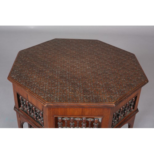 418 - A LATE 19TH CENTURY MAHOGANY MOORISH TABLE OF OCTAGONAL OUTLINE, the surface carved with a repeat ge... 