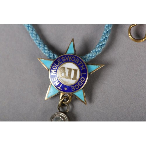 167 - A MASONIC MASTERS JEWEL in sapphire set silver, the square and compass with pendant stone set G belo... 