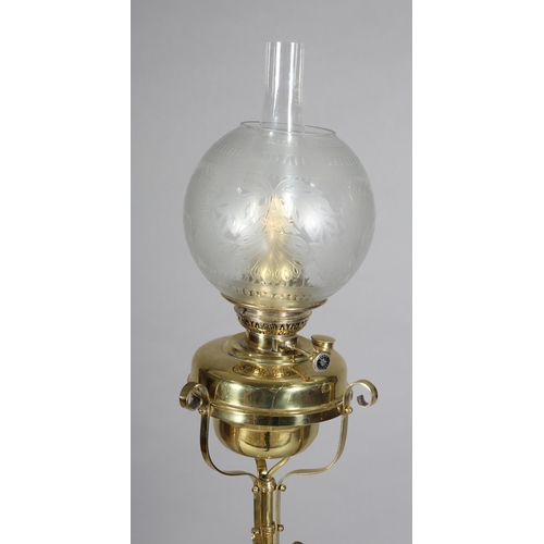 31B - A LATE 19TH CENTURY BRASS STANDARD OIL LAMP, on a centre column and three part barley-twist supports... 