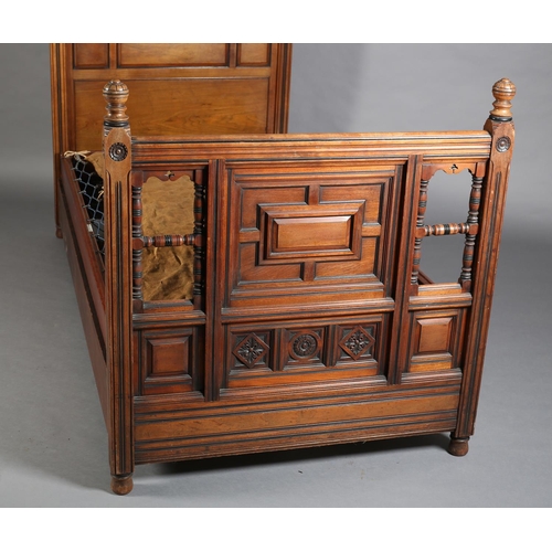 377 - AN EDWARD VII WALNUT SINGLE BEDSTEAD, with ebonised detailing, the curved profile headboard triple f... 