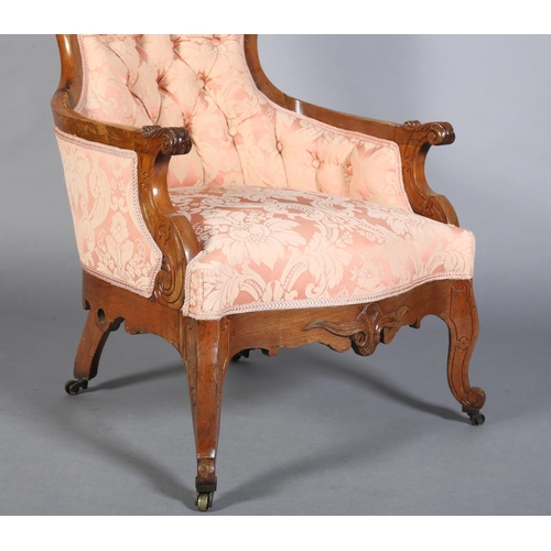 377B - A LATE 19TH CENTURY ROSEWOOD ARMCHAIR, having foliate carved and pierced cresting, the waisted back ... 