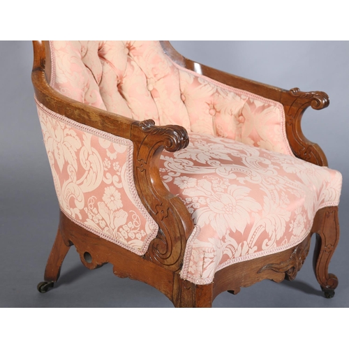 377B - A LATE 19TH CENTURY ROSEWOOD ARMCHAIR, having foliate carved and pierced cresting, the waisted back ... 