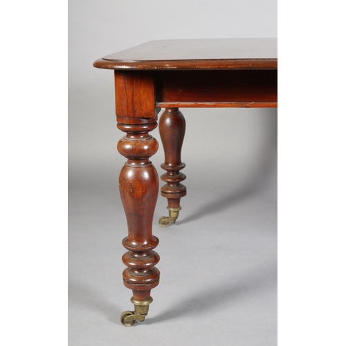 407 - A VICTORIAN MAHOGANY EXTENDING DINING TABLE, to seat eight, moulded rim, on turned legs with brass c... 