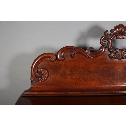 409 - A VICTORIAN FIGURED MAHOGANY PEDESTAL SIDEBOARD, the raised back with carved shell foliate and C-scr... 