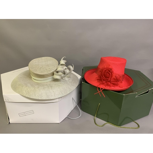 247 - Cosmo Jenks asymmetrical red straw hat with organza rose detail to the grosgrain ribbon, contained i... 