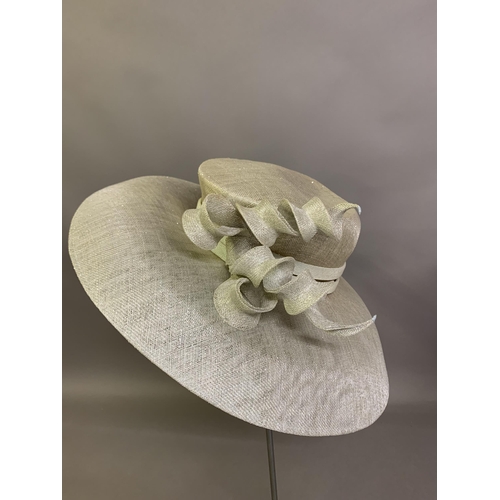 247 - Cosmo Jenks asymmetrical red straw hat with organza rose detail to the grosgrain ribbon, contained i... 