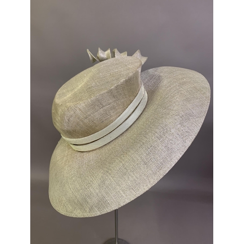 247 - Cosmo Jenks asymmetrical red straw hat with organza rose detail to the grosgrain ribbon, contained i... 