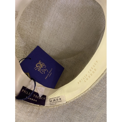 247 - Cosmo Jenks asymmetrical red straw hat with organza rose detail to the grosgrain ribbon, contained i... 