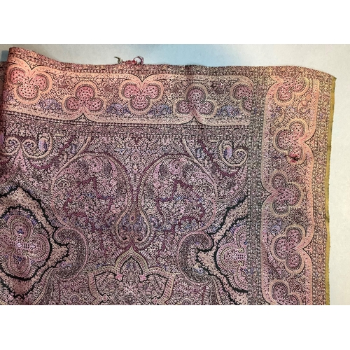 215 - A Paisley shawl woven in pinks, mauve and dark brown, 170cm x 162cm