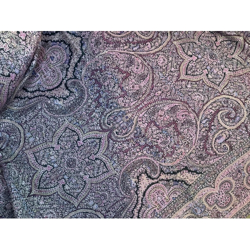 215 - A Paisley shawl woven in pinks, mauve and dark brown, 170cm x 162cm