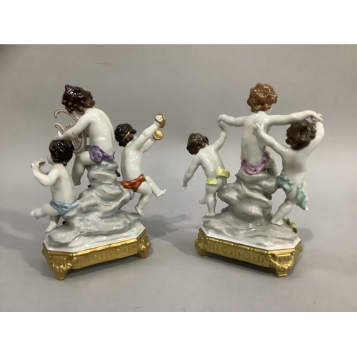 3 - A continental porcelain figure group of three cherubs playing musical instruments on a naturalistic ... 