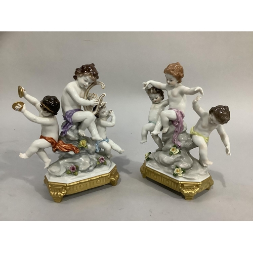 3 - A continental porcelain figure group of three cherubs playing musical instruments on a naturalistic ... 