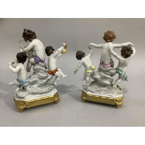 3 - A continental porcelain figure group of three cherubs playing musical instruments on a naturalistic ... 