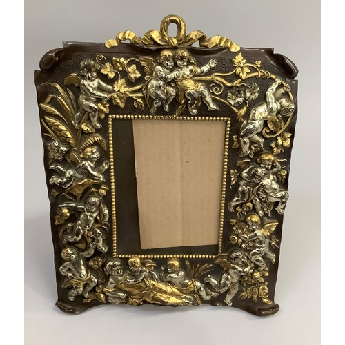 8 - Art Nouveau style continental copper picture frame moulded with cherubs and scrolling vine with loop... 