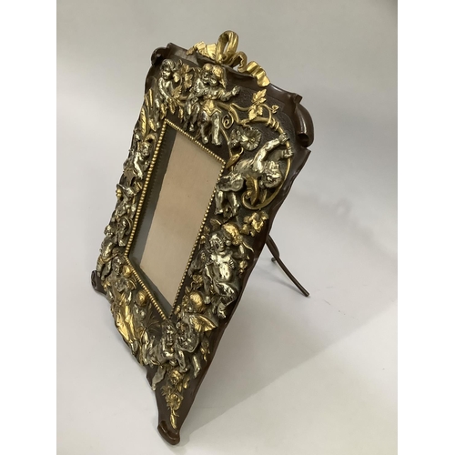 8 - Art Nouveau style continental copper picture frame moulded with cherubs and scrolling vine with loop... 