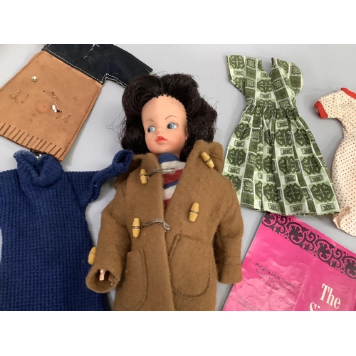 214 - Sindy doll circa 1960's with various outfits and Sindy club magazine and stand