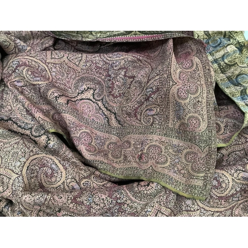 215 - A Paisley shawl woven in pinks, mauve and dark brown, 170cm x 162cm