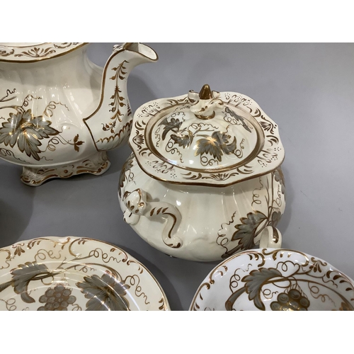 139 - A mid 19th century Rockingham style tea service comprising twelve cups, eleven saucers, milk jug, sl... 