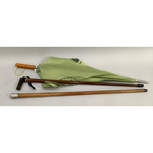 136 - Silver collared walking stick and silver mounted cane together with a Highgrove umbrella with green ... 