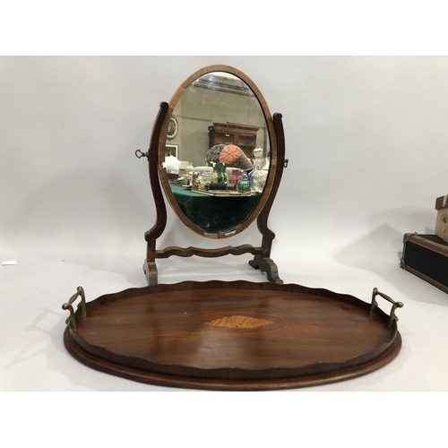 257 - An Edwardian mahogany twin handled tray, the centre inlaid with a shell, together with a mahogany ov... 