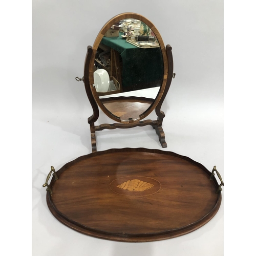 257 - An Edwardian mahogany twin handled tray, the centre inlaid with a shell, together with a mahogany ov... 