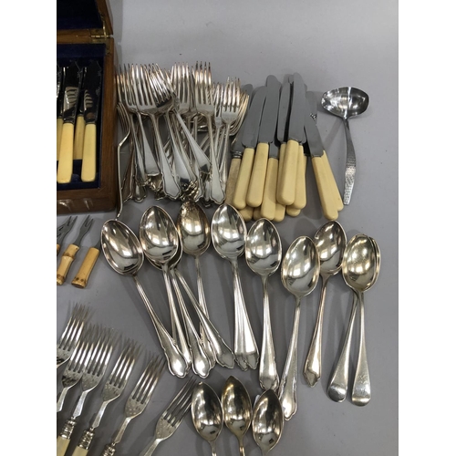 387 - An oak canteen of silver plated fish knives and forks with fish servers together with a further suit... 