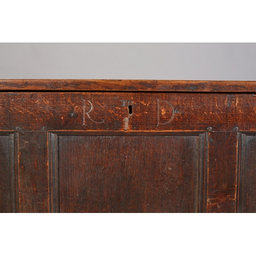 66 - An Early 18th century oak kist having a triple indented top above a frieze carved with the initials ... 