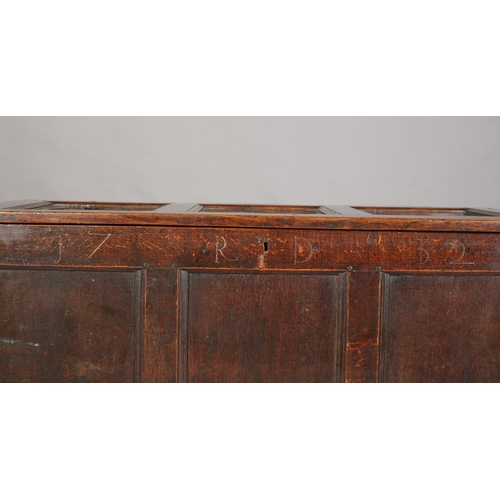 66 - An Early 18th century oak kist having a triple indented top above a frieze carved with the initials ... 