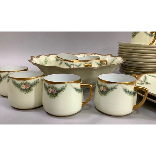 14 - A Silesia hand painted tea service, the cream ground edged in gilt and delicately painted with flora... 