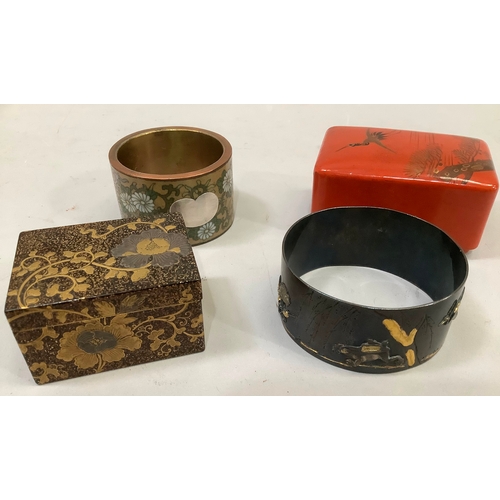 50 - A Japanese bronze napkin ring incised and applied in yellow metal with frog and egret amongst willow... 