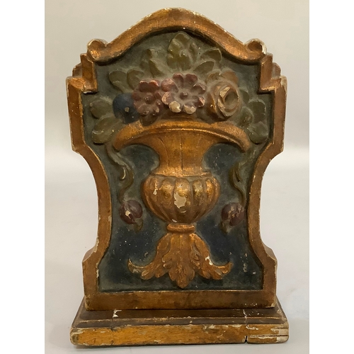 201 - A gilt and polychrome gesso folding book stand, the end panels carved in relief with flower-filled u... 