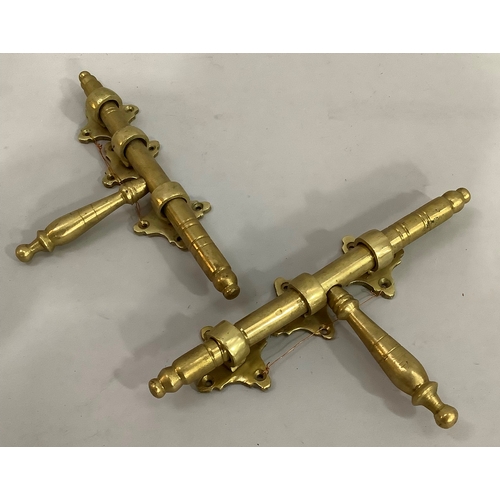 169 - A pair of vintage brass door bolts each with three quatrefoil back plates, 26cm wide (bolt)