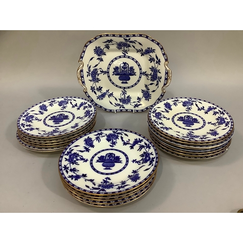 172 - A collection of 20 Minton Delft pattern blue and white dessert plates edged in gilt and a moulded di... 