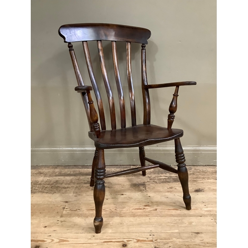 108 - A mahogany slat back country kitchen chair on turned legs with cross stretcher