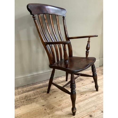 108 - A mahogany slat back country kitchen chair on turned legs with cross stretcher